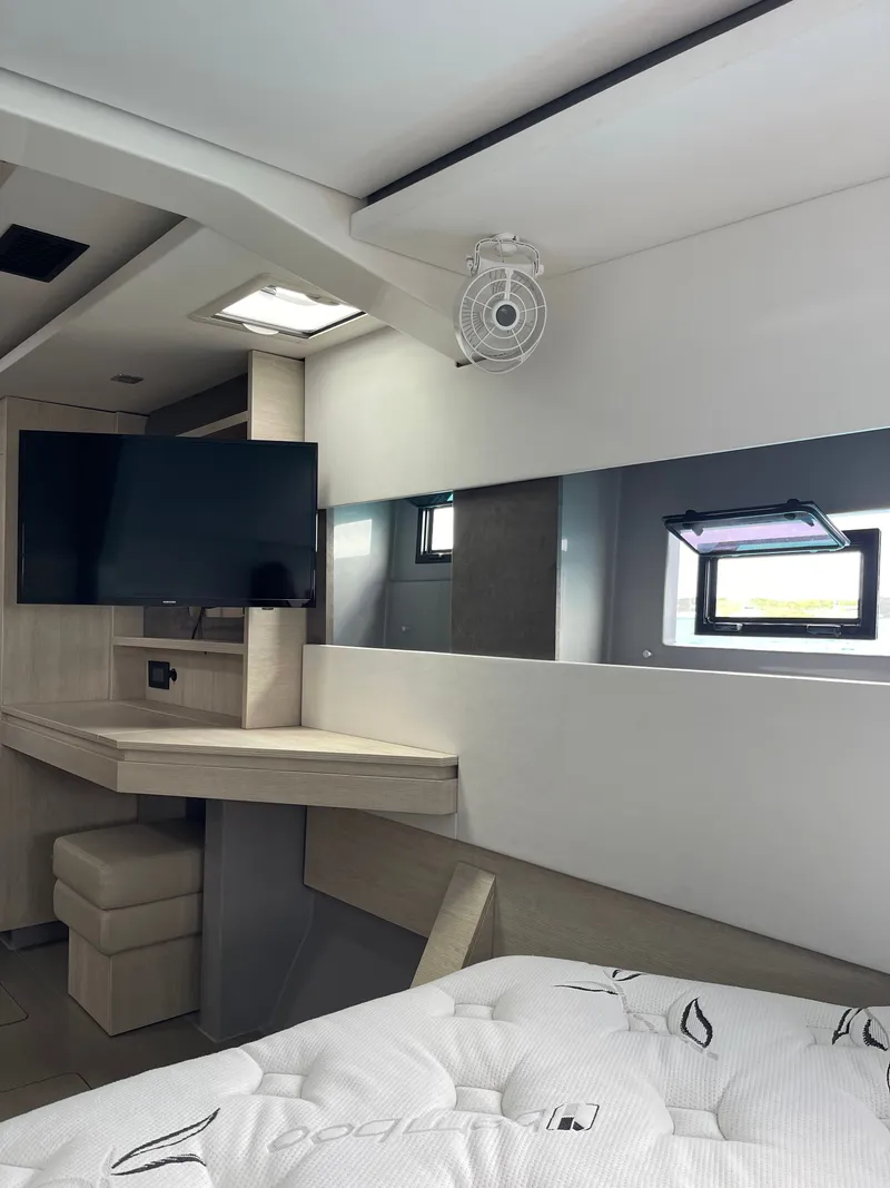 Slide: The Image of Interior of a 2021 Leopard 45 yacht with TV and desk. - 27