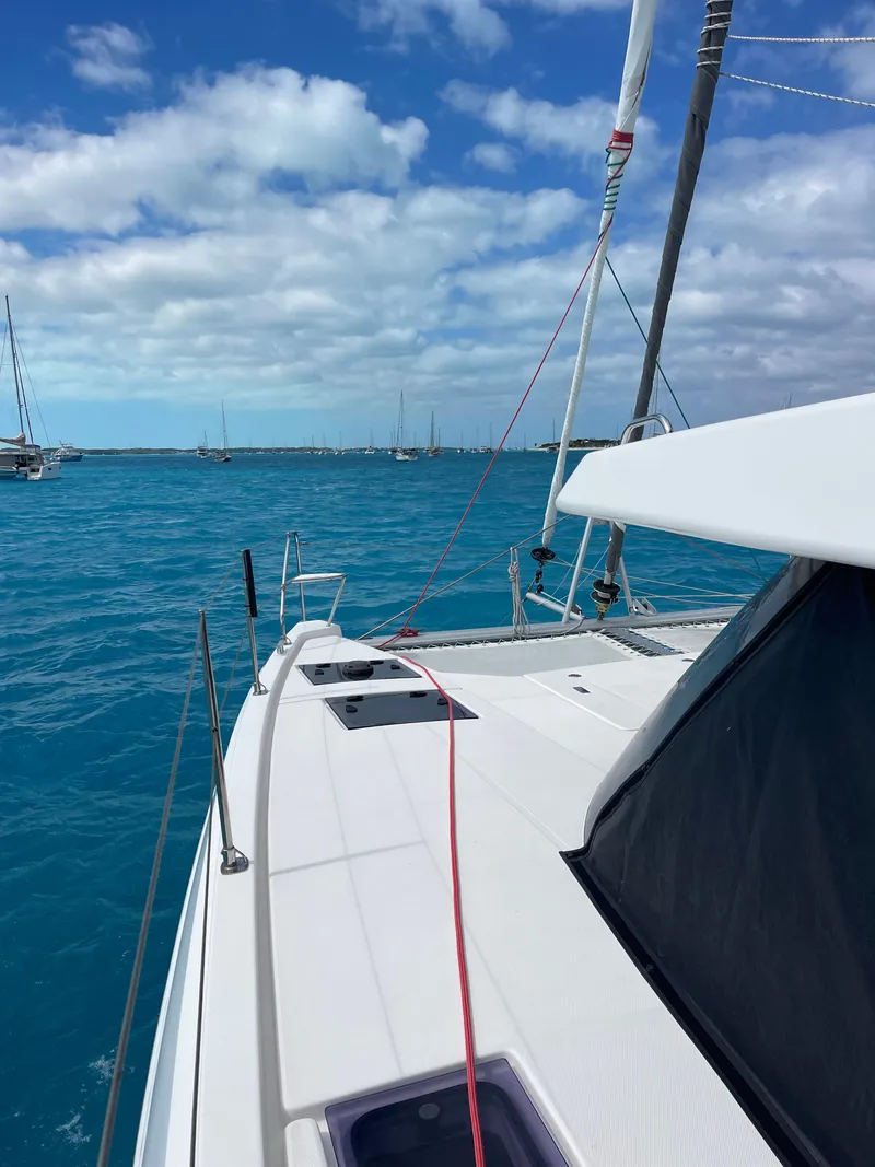 Slide: The Image of Leopard 45 catamaran 2021 on blue water under cloudy sky. - 3