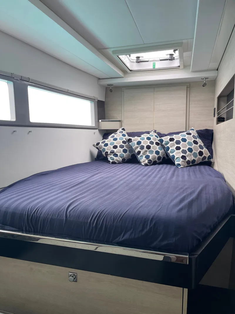 Slide: The Image of Interior of a Leopard 45 yacht with cozy bed and pillows. - 35