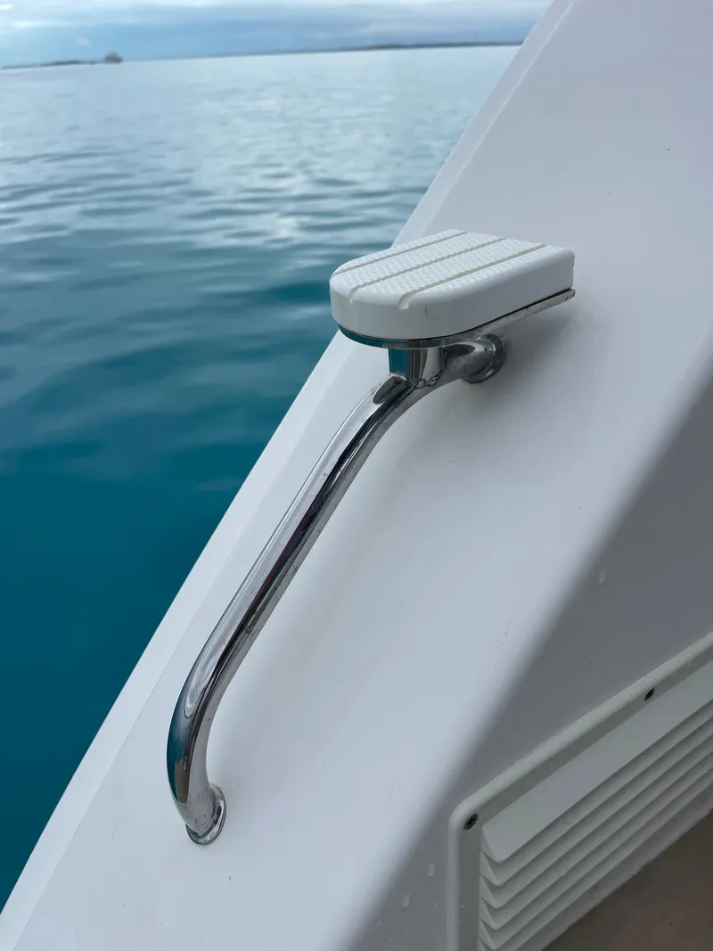 Slide: The Image of Leopard 45 boat, 2021, with stainless steel handle by calm water. - 46