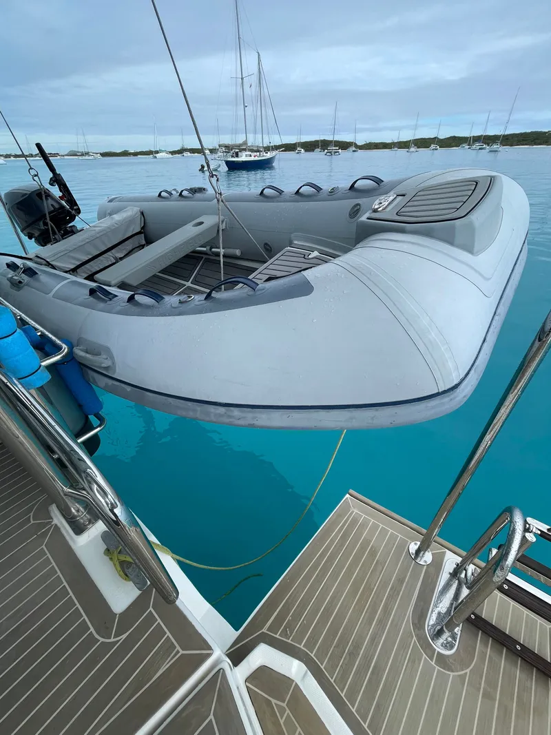 Slide: The Image of Leopard 45 yacht with dinghy on turquoise water, year 2021. - 47