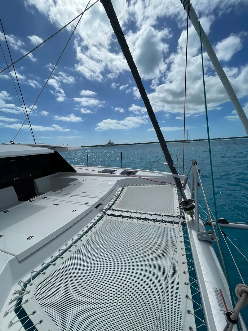 Slide: The Image of Leopard 45 catamaran 2021 on blue sea under cloudy sky. - 5