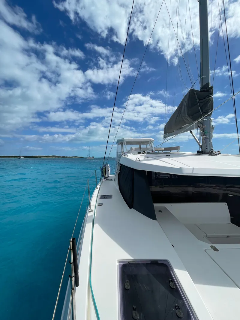 Slide: The Image of Leopard 45 catamaran 2021 on turquoise water under blue sky. - 6