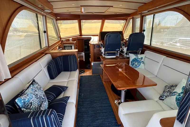 Slide: The Image of Luxurious interior of 2019 Sabre 45 Salon Express yacht with elegant seating and wooden finishes. - 14