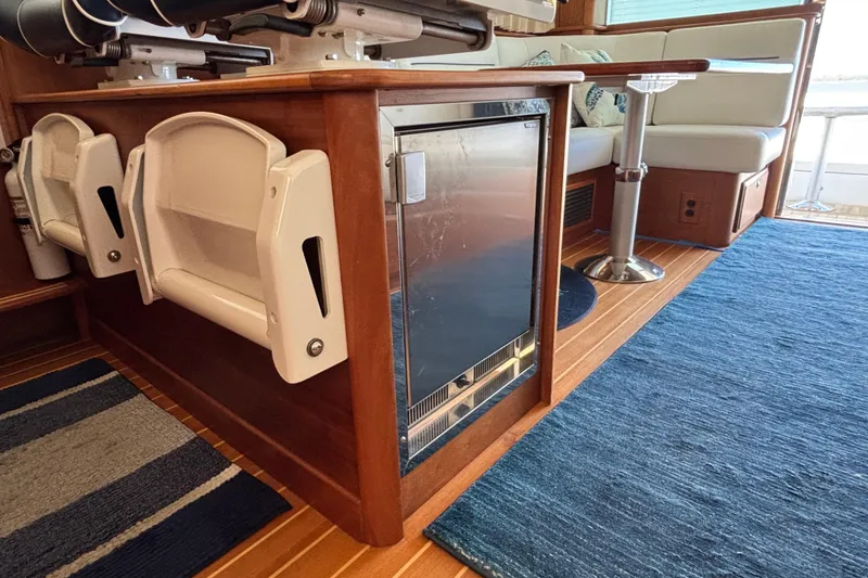 Slide: The Image of Interior of 2019 Sabre 45 Salon Express yacht with seating and mini fridge. - 16