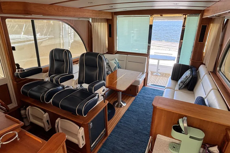 Slide: The Image of Luxurious interior of 2019 Sabre 45 Salon Express yacht with plush seating and ocean view. - 17