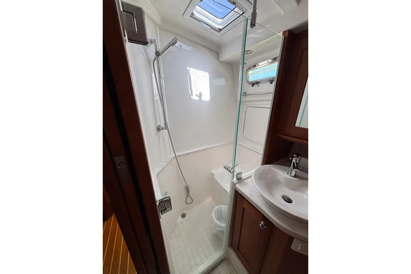 Slide: The Image of Bathroom interior of 2019 Sabre 45 Salon Express yacht, featuring shower and sink. - 26