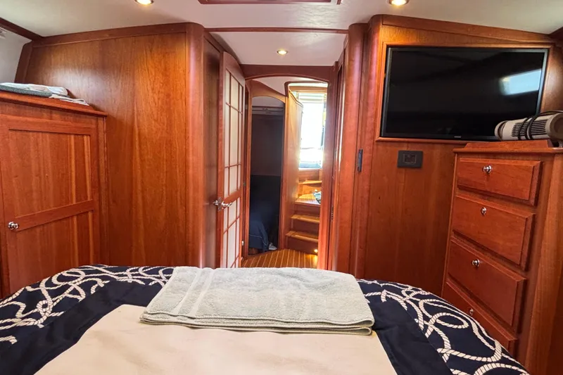 Slide: The Image of Interior of 2019 Sabre 45 Salon Express yacht with wood paneling and modern amenities. - 30