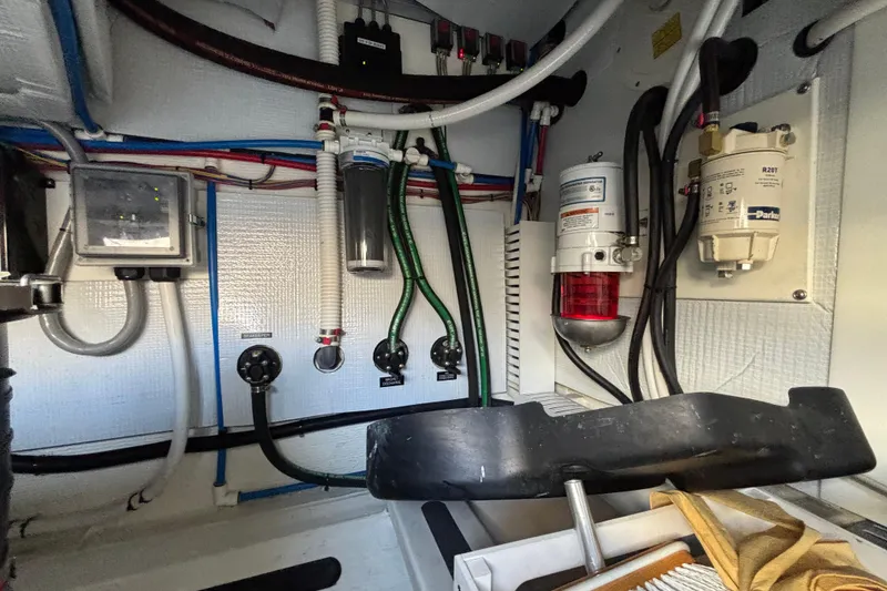 Slide: The Image of Engine room of 2019 Sabre 45 Salon Express with various mechanical components. - 37