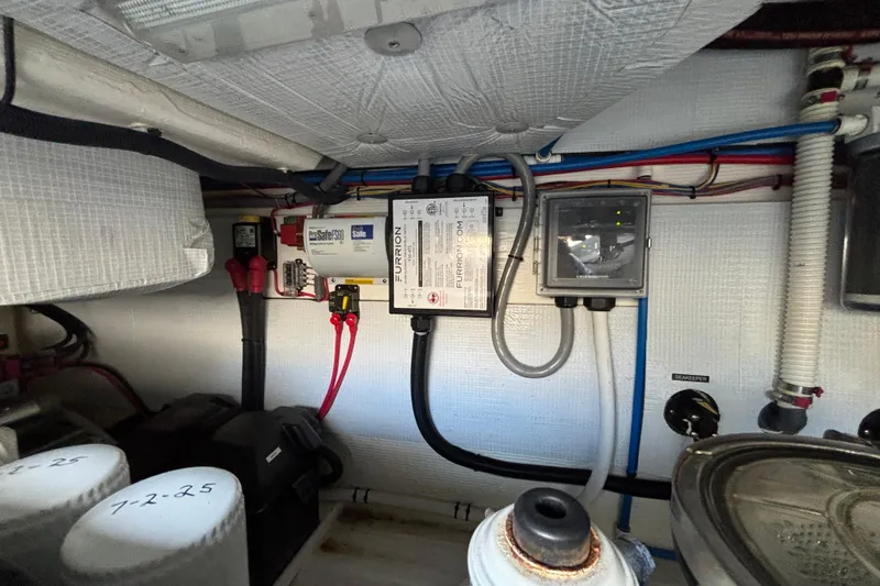 Slide: The Image of Engine room of 2019 Sabre 45 Salon Express with electrical components and wiring. - 39