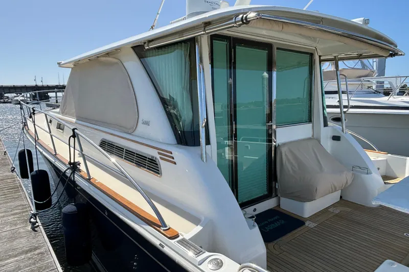 Slide: The Image of 2019 Sabre 45 Salon Express yacht docked, showcasing sleek design and modern features. - 4