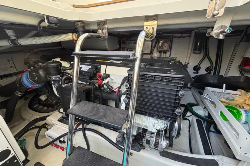 Slide: The Image of Engine room of 2019 Sabre 45 Salon Express with ladder and mechanical components. - 41