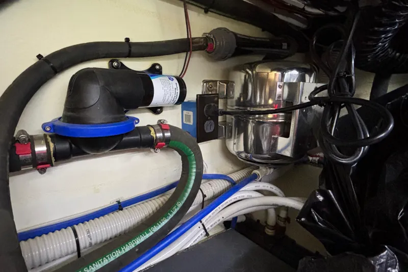 Slide: The Image of Engine room of 2019 Sabre 45 Salon Express with plumbing and electrical components. - 42