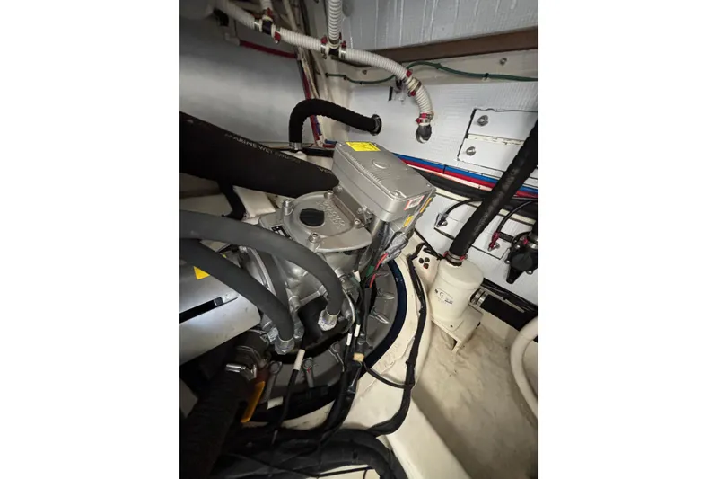 Slide: The Image of Engine room of 2019 Sabre 45 Salon Express with visible components and wiring. - 44