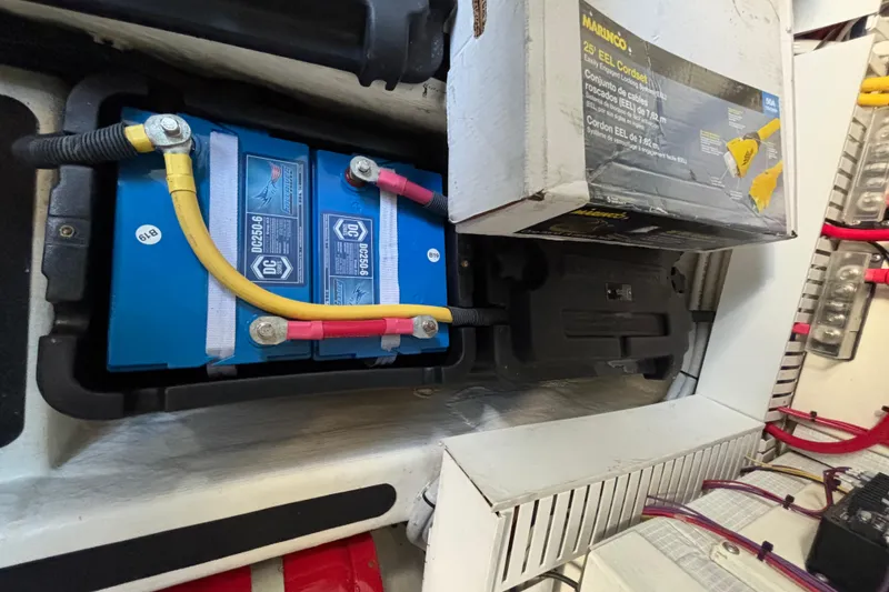 Slide: The Image of Battery compartment of a 2019 Sabre 45 Salon Express with connected cables and a Marico EEL cordset. - 46