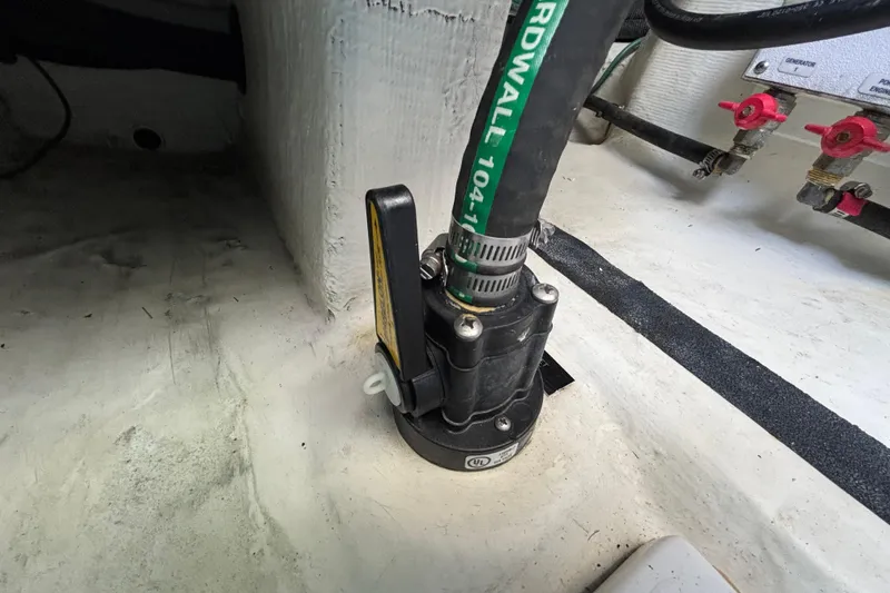 Slide: The Image of Boat plumbing system in 2019 Sabre 45 Salon Express, featuring hoses and valves. - 49