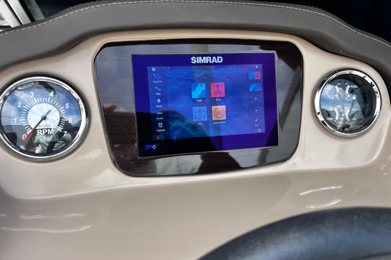 Slide: The Image of Dashboard of 2022 Chaparral 23 SSi boat with Simrad display and gauges. - 16