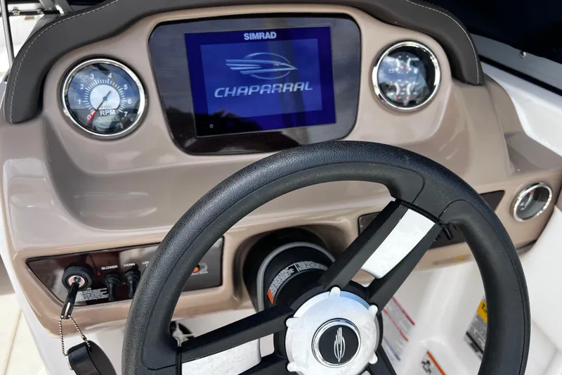 Slide: The Image of Dashboard of 2022 Chaparral 23 SSi boat with steering wheel and digital display. - 17