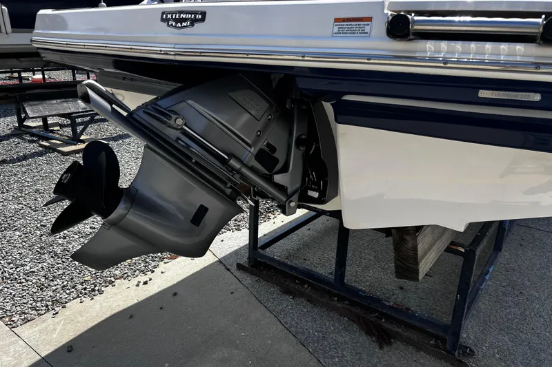 Slide: The Image of 2022 Chaparral 23 SSi boat stern with outboard motor on display stand. - 5