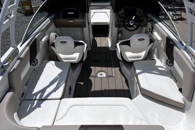 Slide: The Image of 2022 Chaparral 23 SSi boat interior with modern seating and steering wheel. - 9