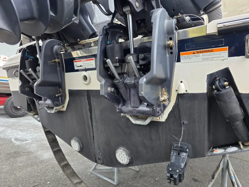Slide: The Image of Close-up of the stern of a Pursuit DC 265 Dual Console boat with motor mounts. - 31