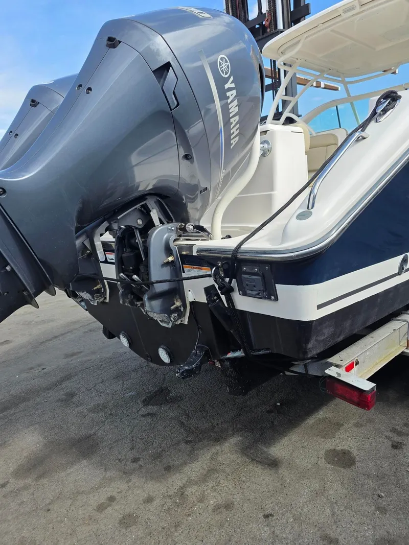 Slide: The Image of 2017 Pursuit DC 265 Dual Console with Yamaha engines at the dock. - 5
