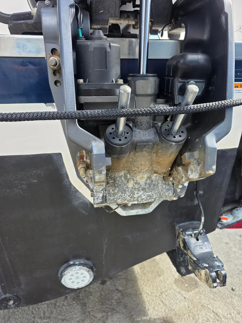 Slide: The Image of Close-up of a 2017 Pursuit DC 265 Dual Console boat engine. - 8