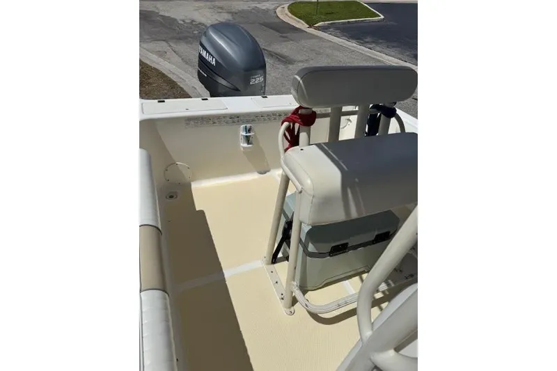 Slide: The Image of 2003 Sea Fox 230 Center Console boat interior with Yamaha outboard motor. - 11