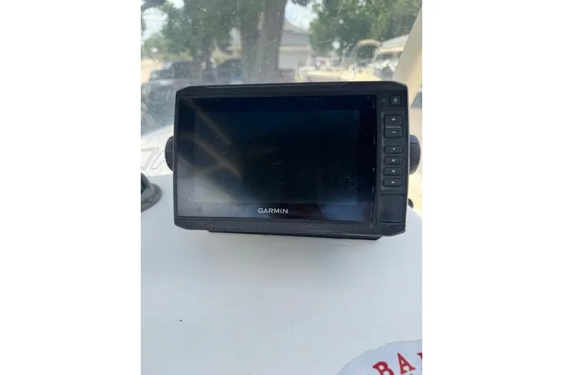 Slide: The Image of Garmin GPS device on 2003 Sea Fox 230 Center Console boat dashboard. - 17