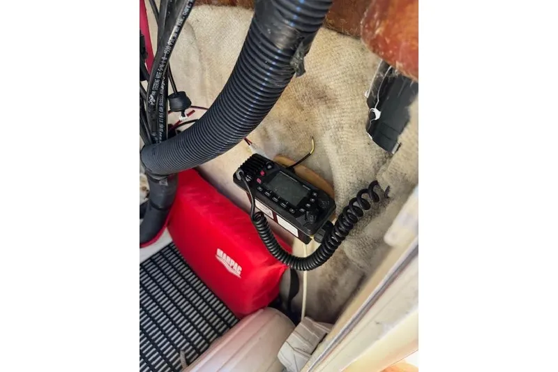 Slide: The Image of Interior of a 2003 Sea Fox 230 Center Console with marine radio and wiring. - 18