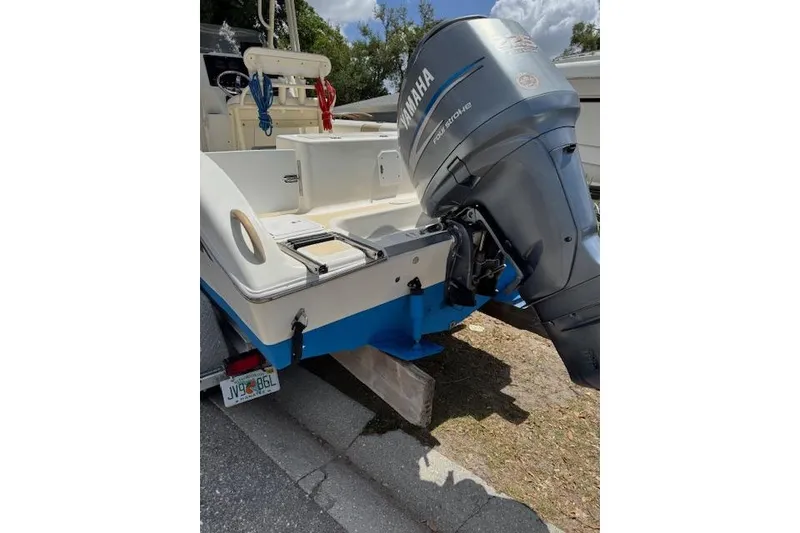 Slide: The Image of 2003 Sea Fox 230 Center Console boat with Yamaha outboard motor, parked on a trailer. - 22