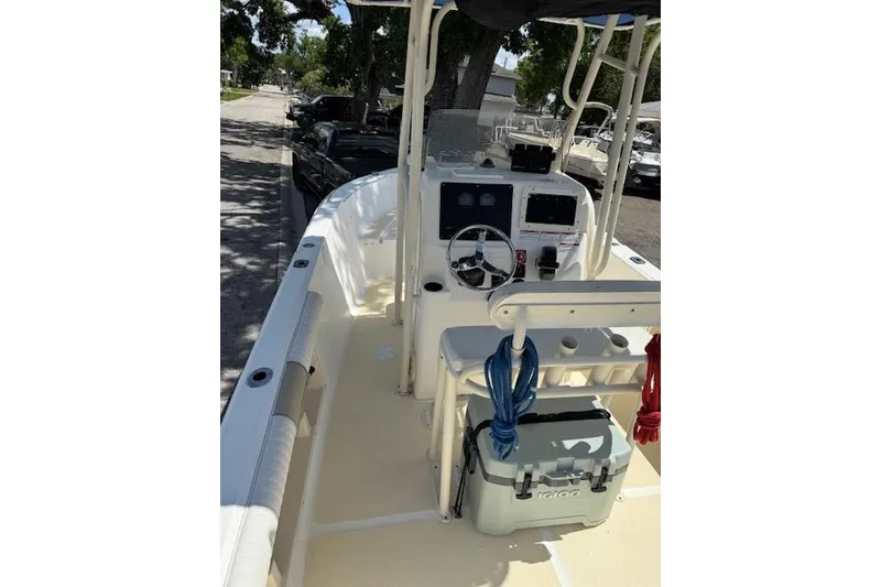 Slide: The Image of 2003 Sea Fox 230 Center Console boat interior with steering wheel and equipment. - 4