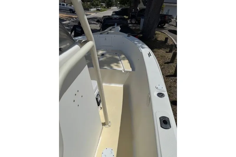 Slide: The Image of 2003 Sea Fox 230 Center Console boat interior, featuring spacious deck and seating area. - 5