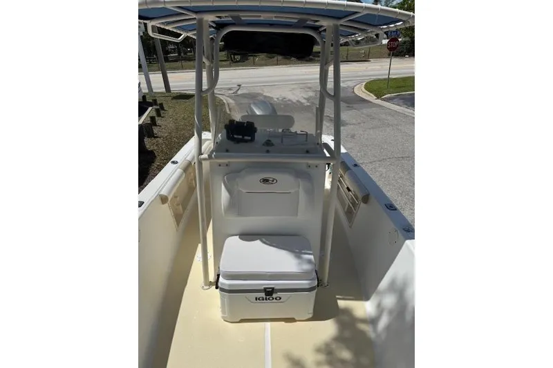 Slide: The Image of 2003 Sea Fox 230 Center Console boat interior with Igloo cooler and shaded console. - 7