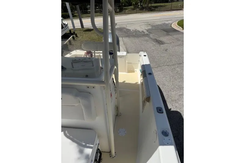 Slide: The Image of 2003 Sea Fox 230 Center Console boat interior, showing seating and console area. - 9