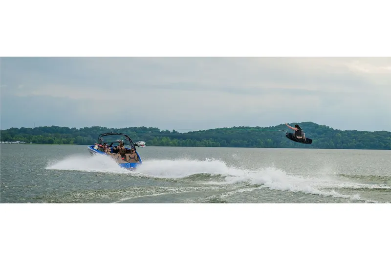 Slide: The Image of Yamaha 222XE 2025 towing wakeboarder on a lake. - 9