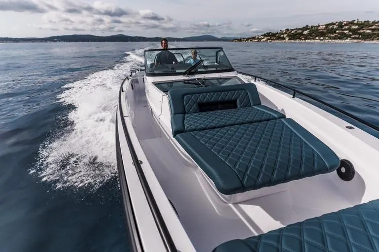 Slide: The Image of 2027 Axopar 37 Spyder cruising on open water with luxurious seating. - 3