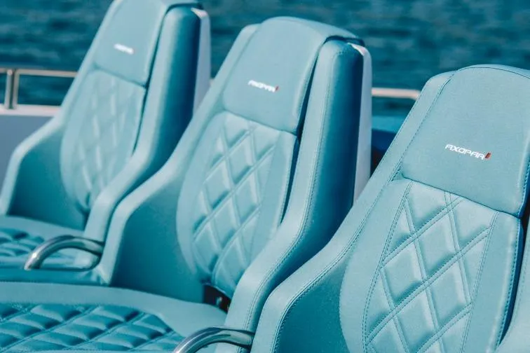 Slide: The Image of Luxurious seating on 2027 Axopar 37 Spyder boat with diamond-stitched design. - 5