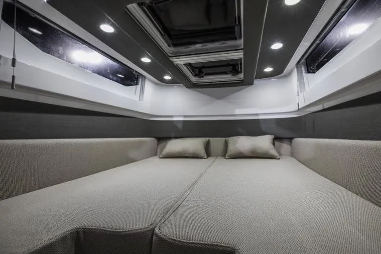 Slide: The Image of Luxurious interior cabin of 2027 Axopar 37 Spyder with modern lighting and comfortable seating. - 9