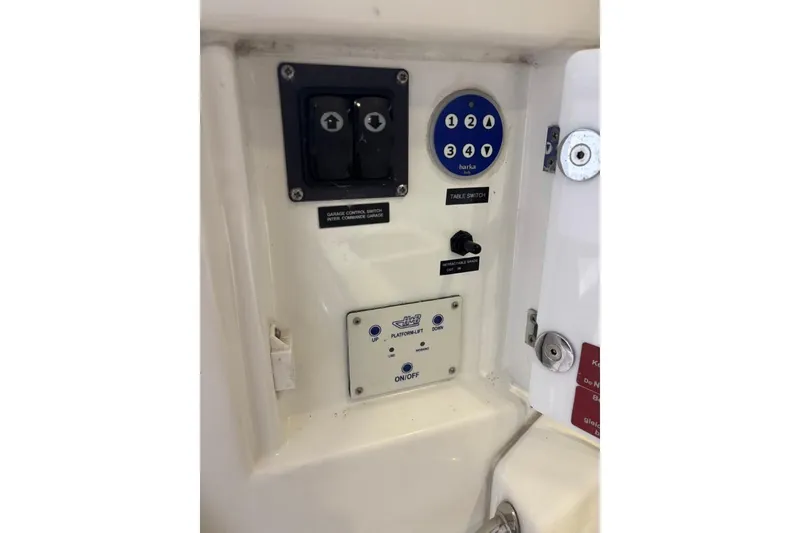 Slide: The Image of Control panel on a 2014 Beneteau Gran Turismo 49 yacht, featuring switches and buttons. - 10