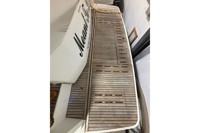 Slide: The Image of 2014 Beneteau Gran Turismo 49 yacht deck with wooden flooring. - 14