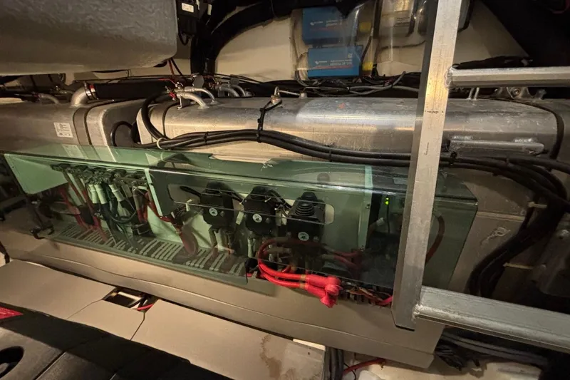 Slide: The Image of Engine room of a 2014 Beneteau Gran Turismo 49 yacht, showcasing mechanical components. - 18