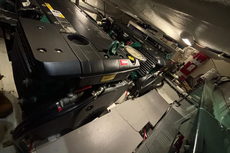 Slide: The Image of Engine room of a 2014 Beneteau Gran Turismo 49 yacht, showcasing dual engines. - 19