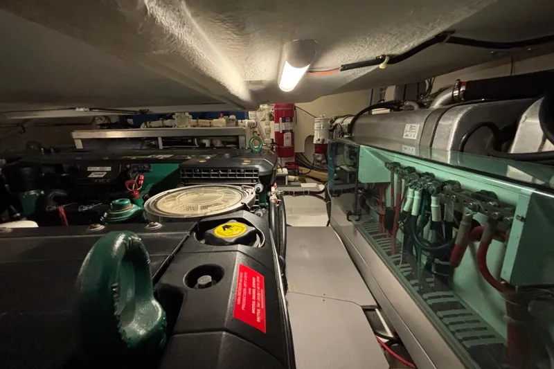 Slide: The Image of Engine room of a 2014 Beneteau Gran Turismo 49 yacht, showcasing mechanical components. - 20