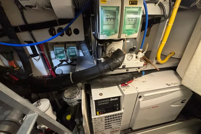 Slide: The Image of Engine room of 2014 Beneteau Gran Turismo 49 with Cummins Onan generator. - 21