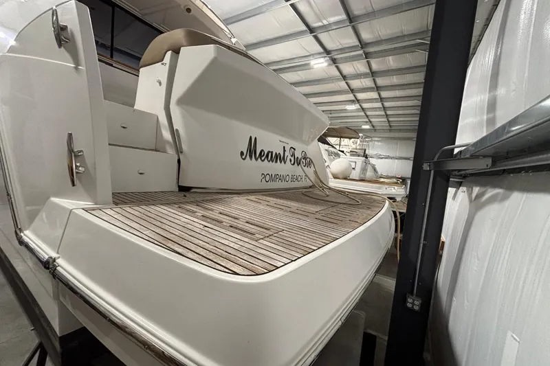 Slide: The Image of 2014 Beneteau Gran Turismo 49 yacht in storage, featuring teak deck and sleek design. - 24