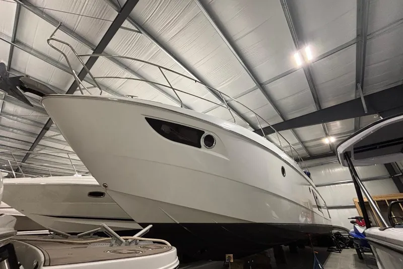 Slide: The Image of 2014 Beneteau Gran Turismo 49 yacht in indoor storage, showcasing sleek design and modern features. - 25