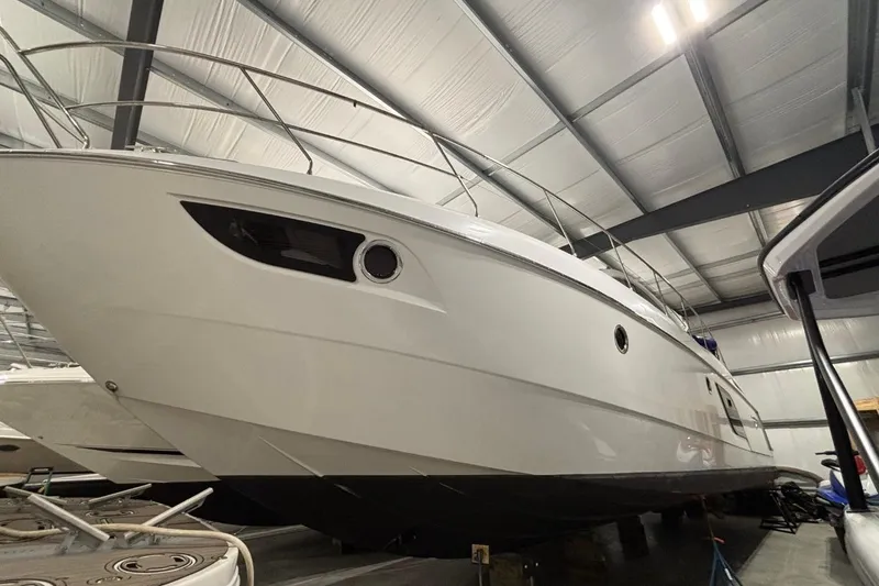 Slide: The Image of 2014 Beneteau Gran Turismo 49 yacht in indoor storage, showcasing sleek design and modern features. - 26