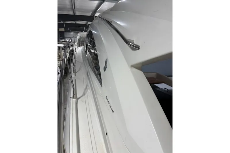 Slide: The Image of 2014 Beneteau Gran Turismo 49 yacht side view in a showroom. - 31