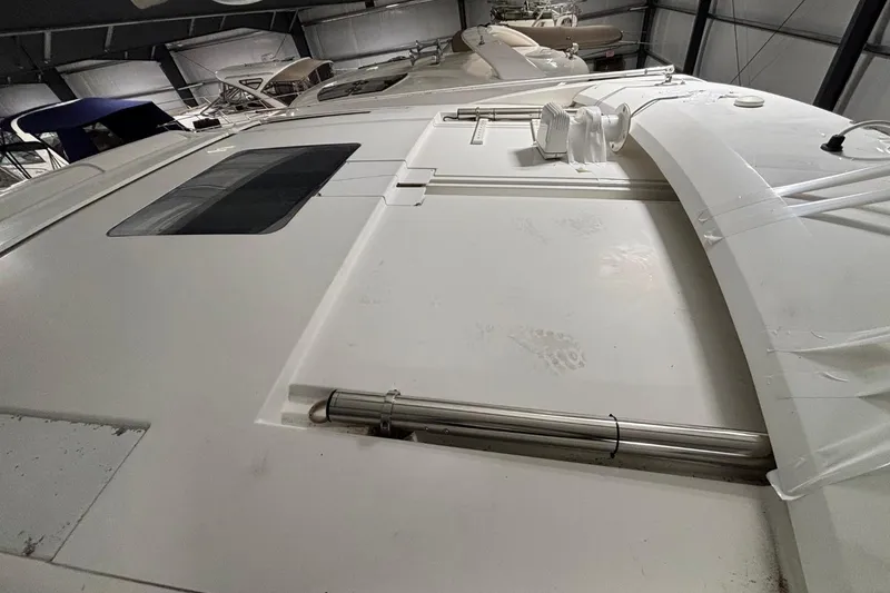 Slide: The Image of 2014 Beneteau Gran Turismo 49 yacht roof in storage, showcasing sleek design and structure. - 32